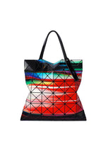 The BAO BAO ISSEY MIYAKE WARP tote bag features black triangular panels in a grid and an original print with red, green, and blue gradients, finished with two black handles. - RED MIX （no.29）