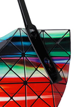 A close-up of the WARP tote by BAO BAO ISSEY MIYAKE, featuring geometric triangular patterns, glossy black straps, and bold multicolored enamel stripes in red, green, blue, and black for a striking original look.