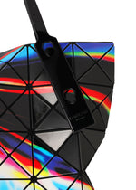 Close-up of the BAO BAO ISSEY MIYAKE WARP tote bag, featuring geometric triangular panels and a glossy handle. Crafted from enamel material, it showcases a vibrant rainbow pattern that reflects light beautifully.