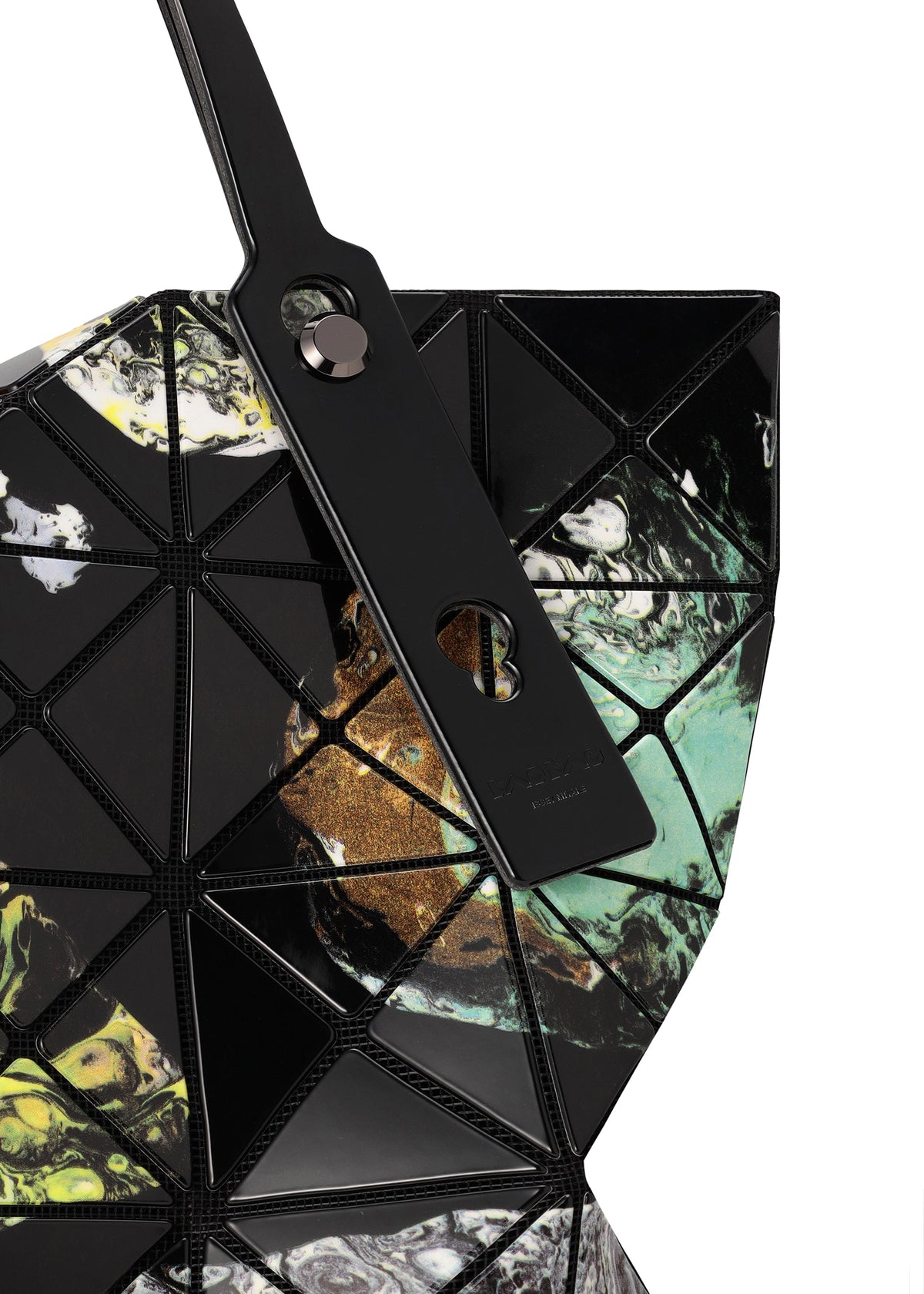 A close-up of the COSMIC tote bag by BAO BAO ISSEY MIYAKE, featuring geometric panels in black, green, yellow, and white marbled enamel with a black strap enhanced by metallic hardware—perfectly sized for carrying your A4-sized documents. view 7 of 10