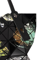 A close-up of the COSMIC tote bag by BAO BAO ISSEY MIYAKE, featuring geometric panels in black, green, yellow, and white marbled enamel with a black strap enhanced by metallic hardware—perfectly sized for carrying your A4-sized documents.