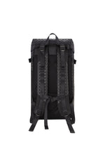 A black HIKER backpack by BAO BAO ISSEY MIYAKE shown from the back, with adjustable padded shoulder straps, a top handle, chest strap, laptop pocket, and a patterned design on the back panel and straps.