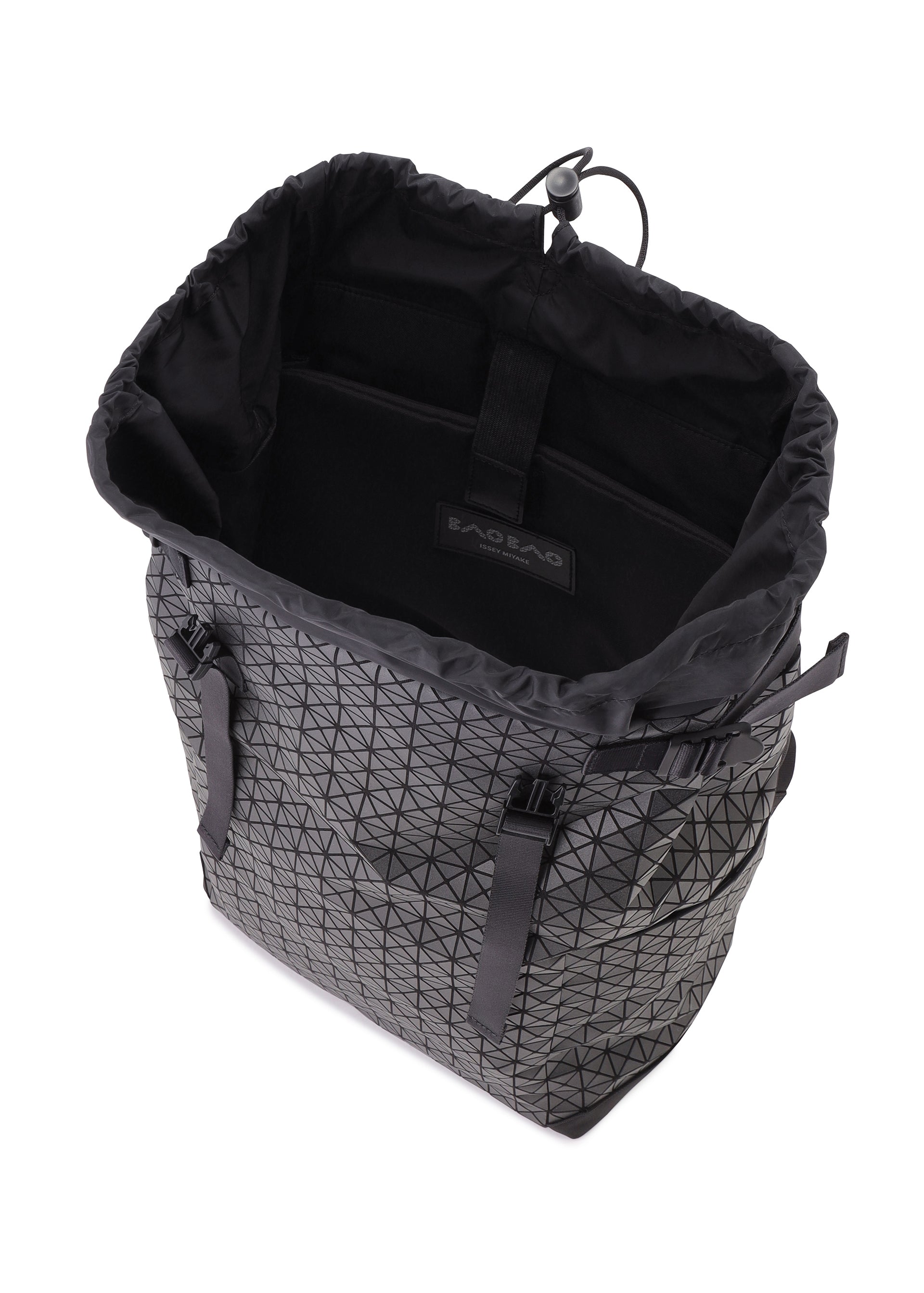 Zoomed view The HIKER tote by BAO BAO ISSEY MIYAKE features a black geometric pattern, drawstring opening, interior lining with Baobao label, adjustable side straps, open compartment, and a laptop pocket.