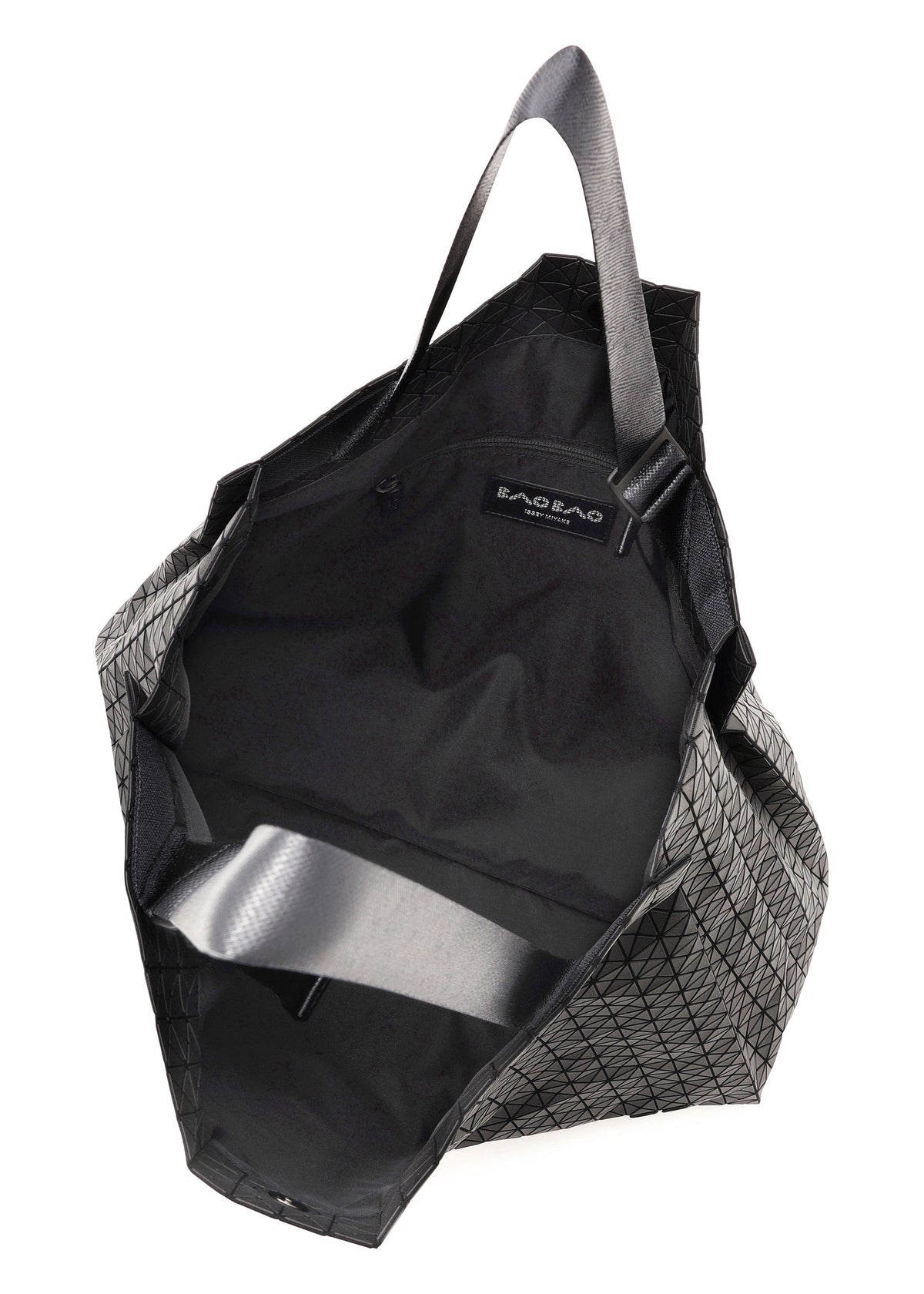 A geometric-patterned black BAO BAO ISSEY MIYAKE CART tote bag with an open top, two handles, fabric lining, interior label, and a spacious interior—ideal for carrying an A4 laptop. view 4 of 6