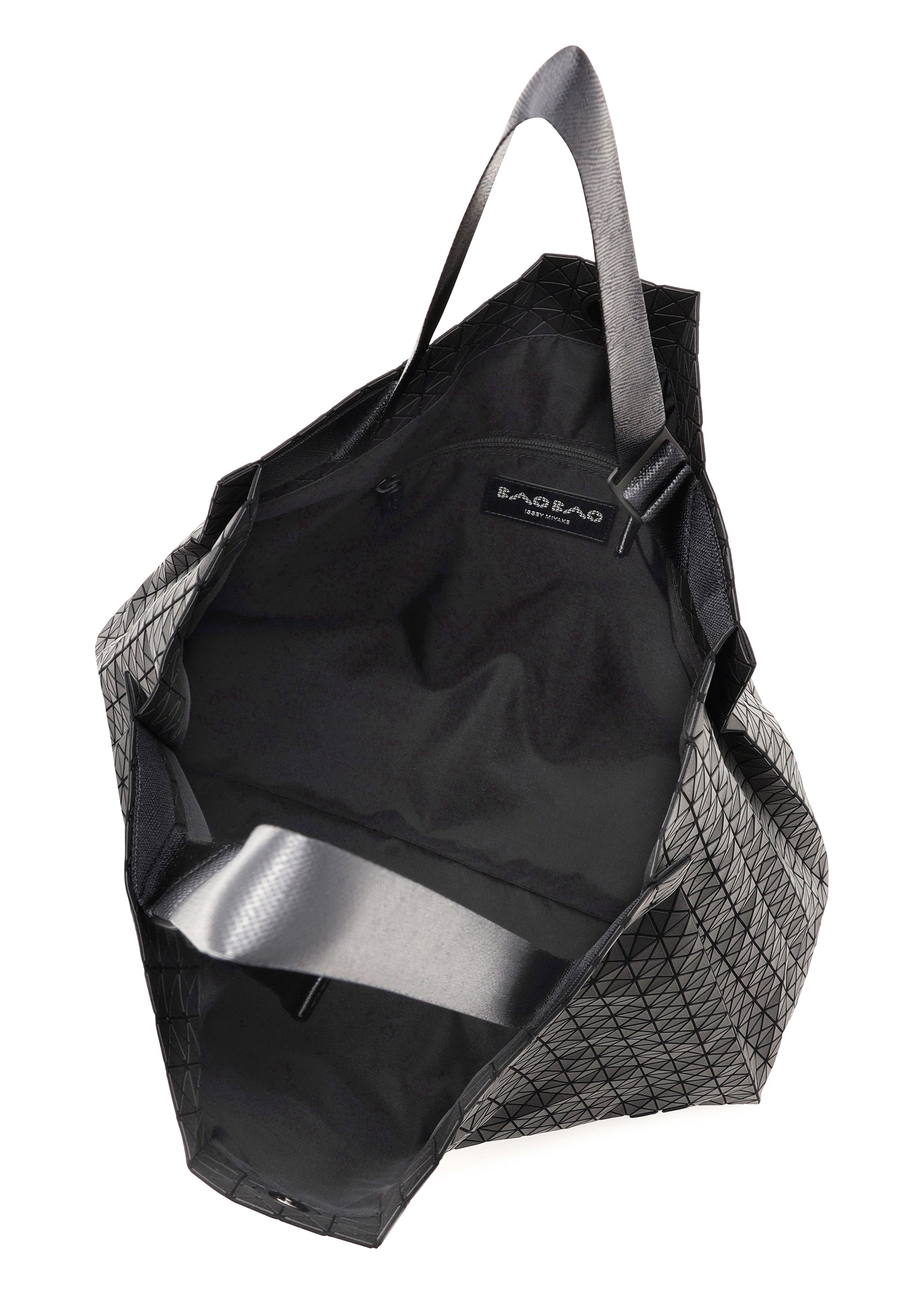 Zoomed view A geometric-patterned black BAO BAO ISSEY MIYAKE CART tote bag with an open top, two handles, fabric lining, interior label, and a spacious interior—ideal for carrying an A4 laptop.