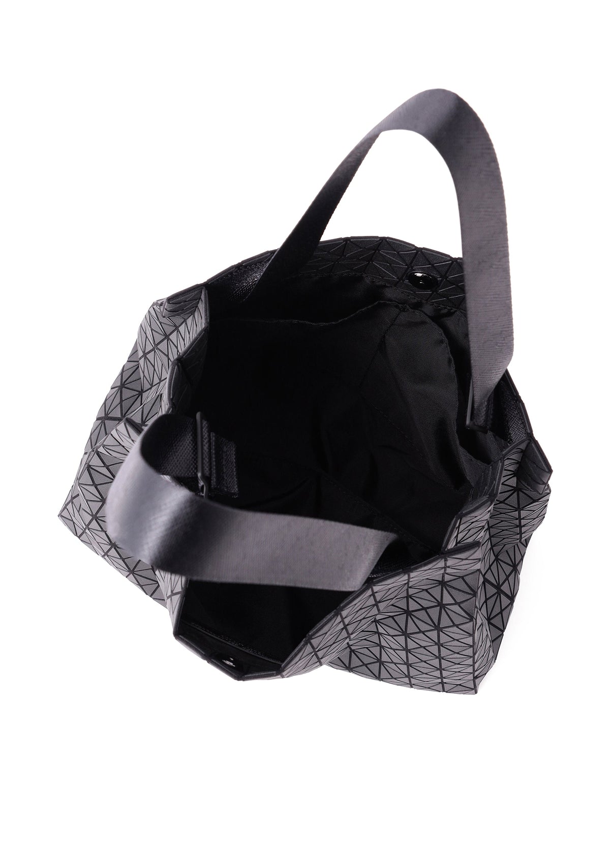 Zoomed view The CART MINI by BAO BAO ISSEY MIYAKE is a black, geometric-patterned lightweight tote with short handles, shown from above to reveal its spacious interior and dark lining.