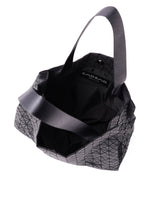The CART MINI by BAO BAO ISSEY MIYAKE is a black geometric-patterned lightweight tote with two handles, shown from above with its open interior visible.