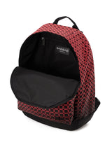 A red geometric-patterned DAYPACK GRADUAL backpack from BAO BAO ISSEY MIYAKE, distinguished by its striking three-dimensional shape, features a black inner lining and a front flap that opens to reveal the spacious main compartment and a small inner pocket adorned with a visible BAOBAG label.