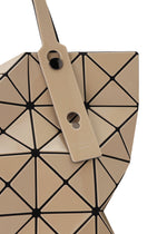 A beige LUCENT GLOSS tote bag by BAO BAO ISSEY MIYAKE made of a geometric grid of triangular tiles with a tan strap attached by a black fastener.