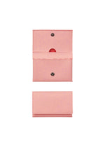 Two views of the PACKAGE card case by GOOD GOODS ISSEY MIYAKE in pink: one open to show its inner pocket and perforated lines, and one closed—both set against a white background. A stylish and thoughtful gift idea. - PINK （no.22）