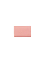A small, rectangular, pink bifold PACKAGE card case by GOOD GOODS ISSEY MIYAKE sits centered on a plain white background. The minimalist wallet is closed, with no visible logos or embellishments—an ideal gift.