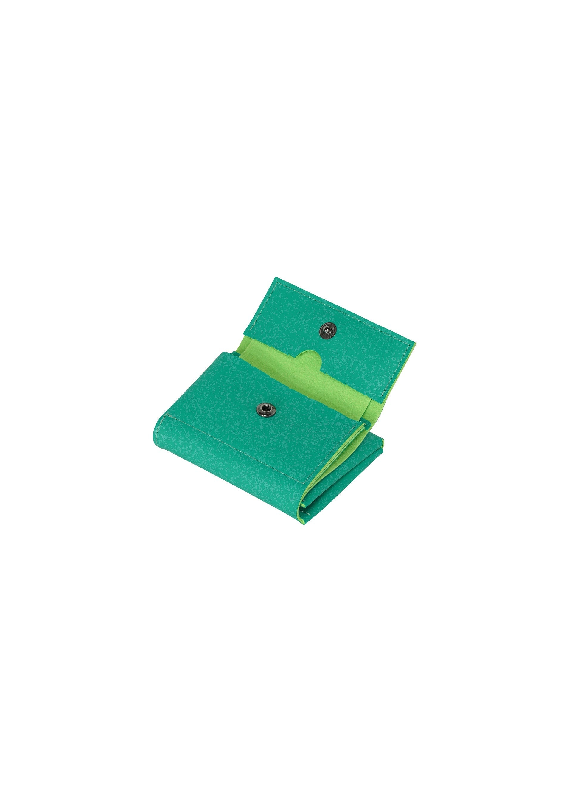 Zoomed view The GOOD GOODS ISSEY MIYAKE PACKAGE is a small, green textured tri-fold mini wallet with a snap button closure and light green interior pocket, shown open against a white background—an ideal thoughtful gift.