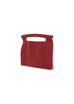 The KURURI by GOOD GOODS ISSEY MIYAKE is a red, rectangular felt bag with a built-in top handle and open side, displayed on a white background.