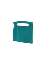 The KURURI bag by GOOD GOODS ISSEY MIYAKE is a teal felt fabric bag with a built-in handle and minimalist design, shown against a white background.