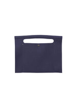 The KURURI by GOOD GOODS ISSEY MIYAKE is a flat, rectangular dark blue fabric bag featuring a top handle cutout and a central metal snap button closure. - NAVY （no.75）