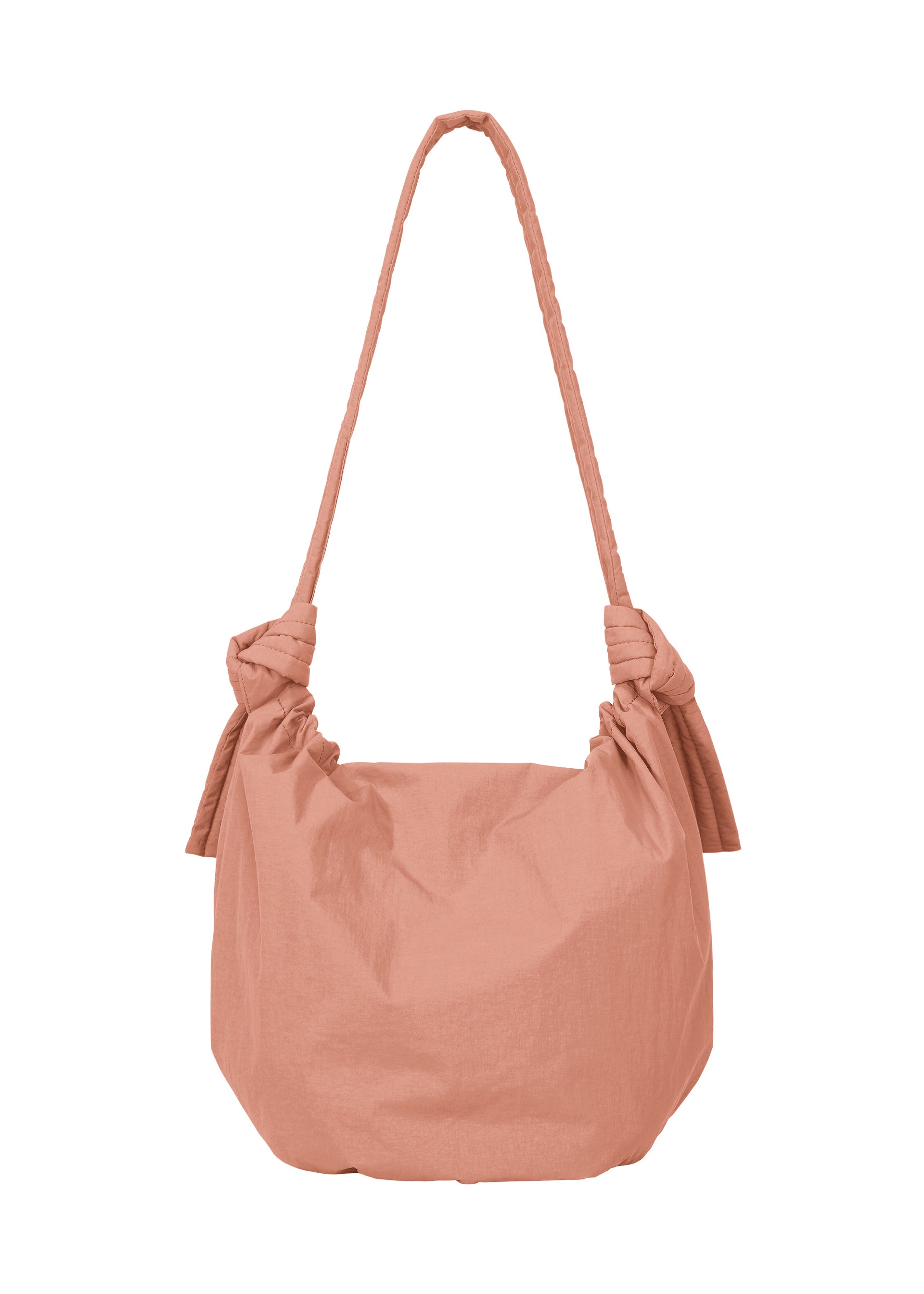 Zoomed view The FUWA FUWA by GOOD GOODS ISSEY MIYAKE is a light pink fabric shoulder bag with a single strap and large decorative knots, inspired by traditional Japanese zero-waste design.