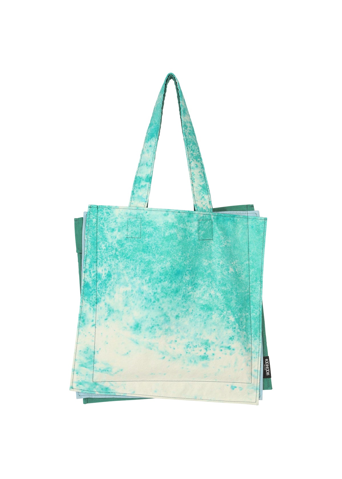 The IROGAMI SALT DYE reusable tote bag from GOOD GOODS ISSEY MIYAKE features a turquoise and white marbled pattern made with traditional Shio-zome dyeing, shown against a plain white background. view 5 of 10
