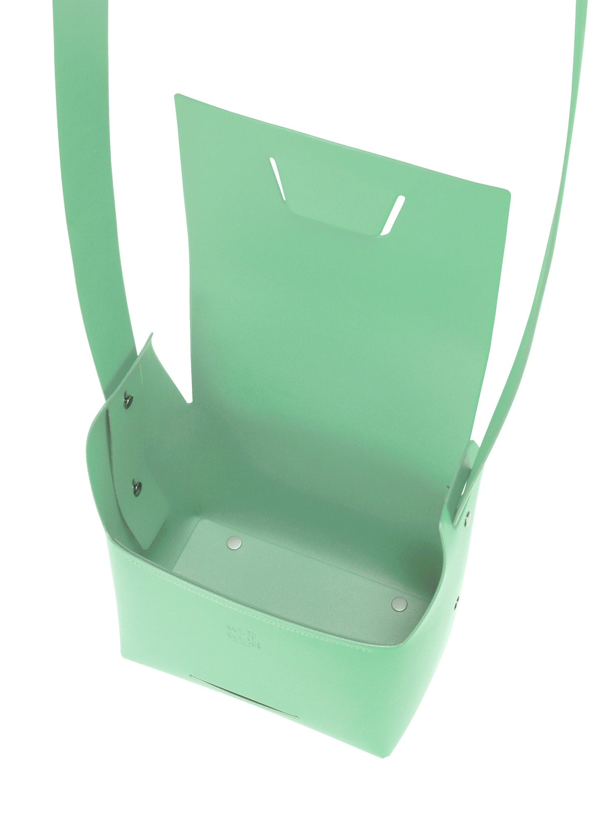 The BOX bag by GOOD GOODS ISSEY MIYAKE is a mint green, rectangular, box-inspired design with an open top, wide strap, and metal corner rivets, shown from above. view 5 of 11