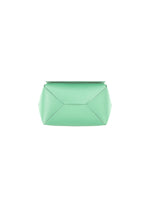 The BOX bag by GOOD GOODS ISSEY MIYAKE, featuring a minimalist mint green geometric design, is displayed on a plain white background and shown from the bottom view.