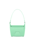 The BOX bag by GOOD GOODS ISSEY MIYAKE is a minimalist, rectangular mint green accessory with a single top handle, shown from the front on a white background.
