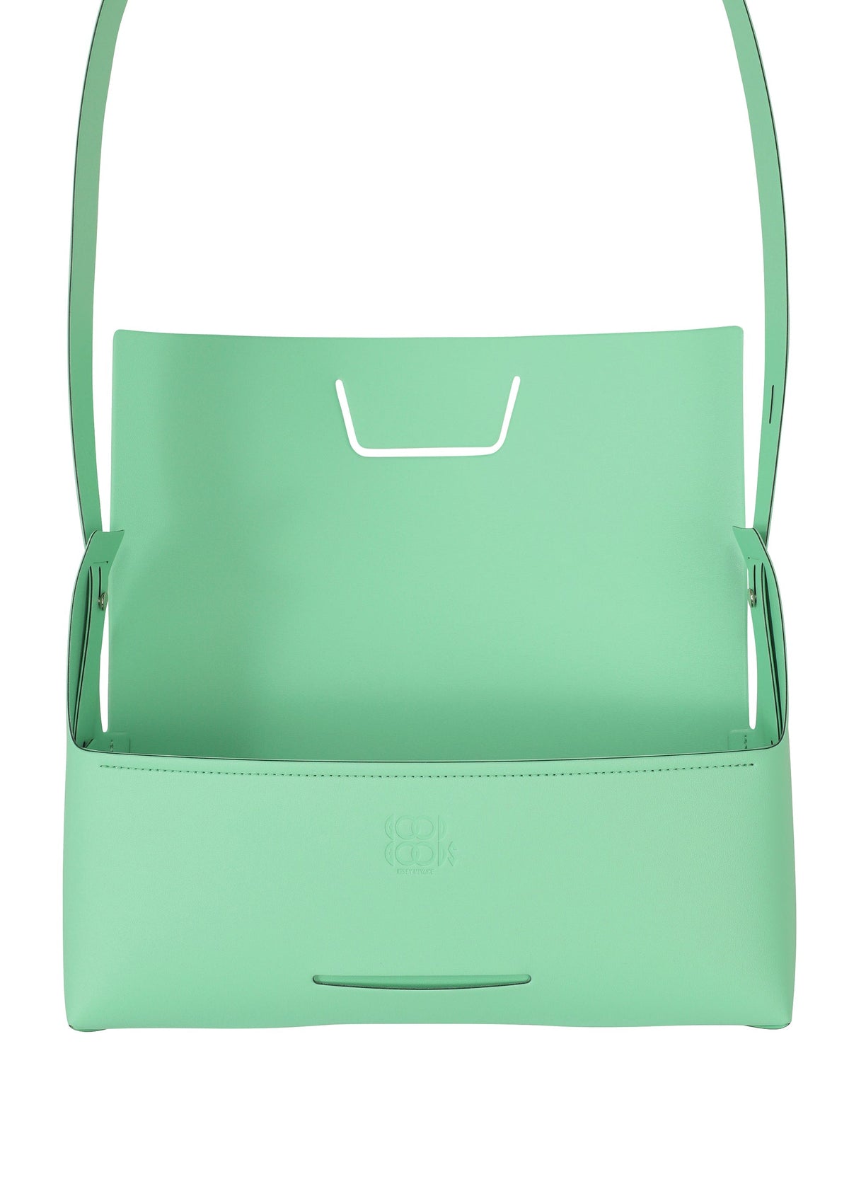 The BOX by GOOD GOODS ISSEY MIYAKE is a mint green leather convertible shoulder bag with a minimalist, box-inspired shape, an open top, slim strap, and subtle embossed front logo. view 4 of 9