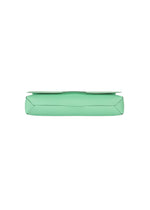 A flat, rectangular, mint green object resembling a closed envelope is seen from the side against a white background. This sleek item is BOX by GOOD GOODS ISSEY MIYAKE, inspired by box-shaped bags—perhaps the 26SS new model.