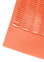 Close-up of the MOKKO S.C. knit tote bag by GOOD GOODS ISSEY MIYAKE, featuring an orange textured surface with horizontal slits and angled edge—showcasing a bold, flexible, washable design for Spring Summer 2026.