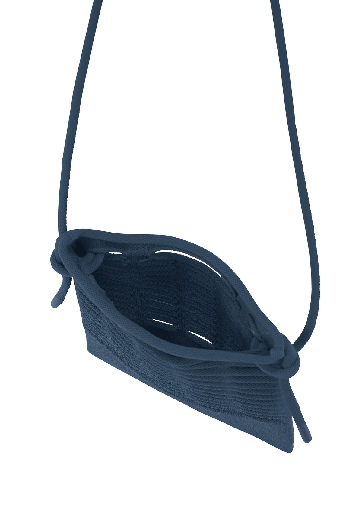 The MOKKO S.C. by GOOD GOODS ISSEY MIYAKE is a small navy knit crossbody pochette with a long detachable strap, open top, and side knots at the attachments—shown from above to reveal its interior. Perfect for Spring Summer 2026. view 4 of 7