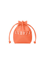 The MOKKO S.C. POCKET by GOOD GOODS ISSEY MIYAKE is a small orange knit drawstring bag with a knotted cord and oval cut-out design, ideal for Spring Summer 2026, shown on a white background. - ORANGE CORAL （no.31）