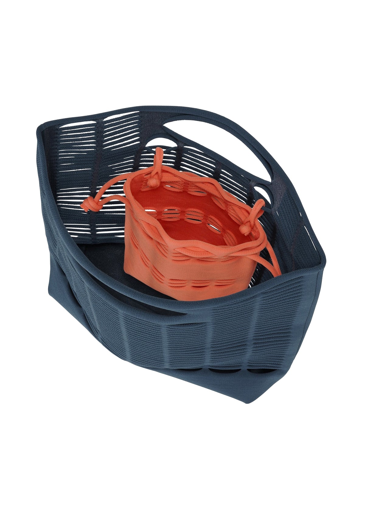 The MOKKO S.C. POCKET by GOOD GOODS ISSEY MIYAKE features a blue washable, wavy open-weave bag holding a smaller orange knit drawstring pouch—ideal for Spring Summer 2026 and shown on a white background. view 6 of 7
