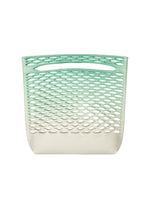 The MOKKO NET GRADATION by GOOD GOODS ISSEY MIYAKE is a plastic basket with an ombre green-to-white fade, oval perforations, and an integrated handle inspired by lightweight knit bags. - ICE GREEN （no.69）