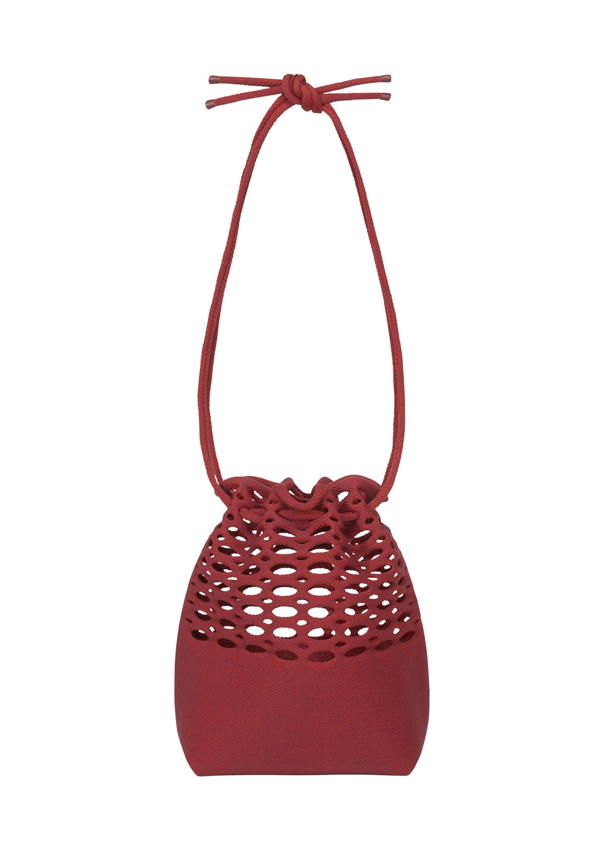 The MOKKO BASKET by GOOD GOODS ISSEY MIYAKE is a small, red knit bag with a honeycomb-patterned cutout upper, solid bottom, and bow-tied drawstring top. Washable and stylish, it captures the charm of classic basket bags. view 3 of 11