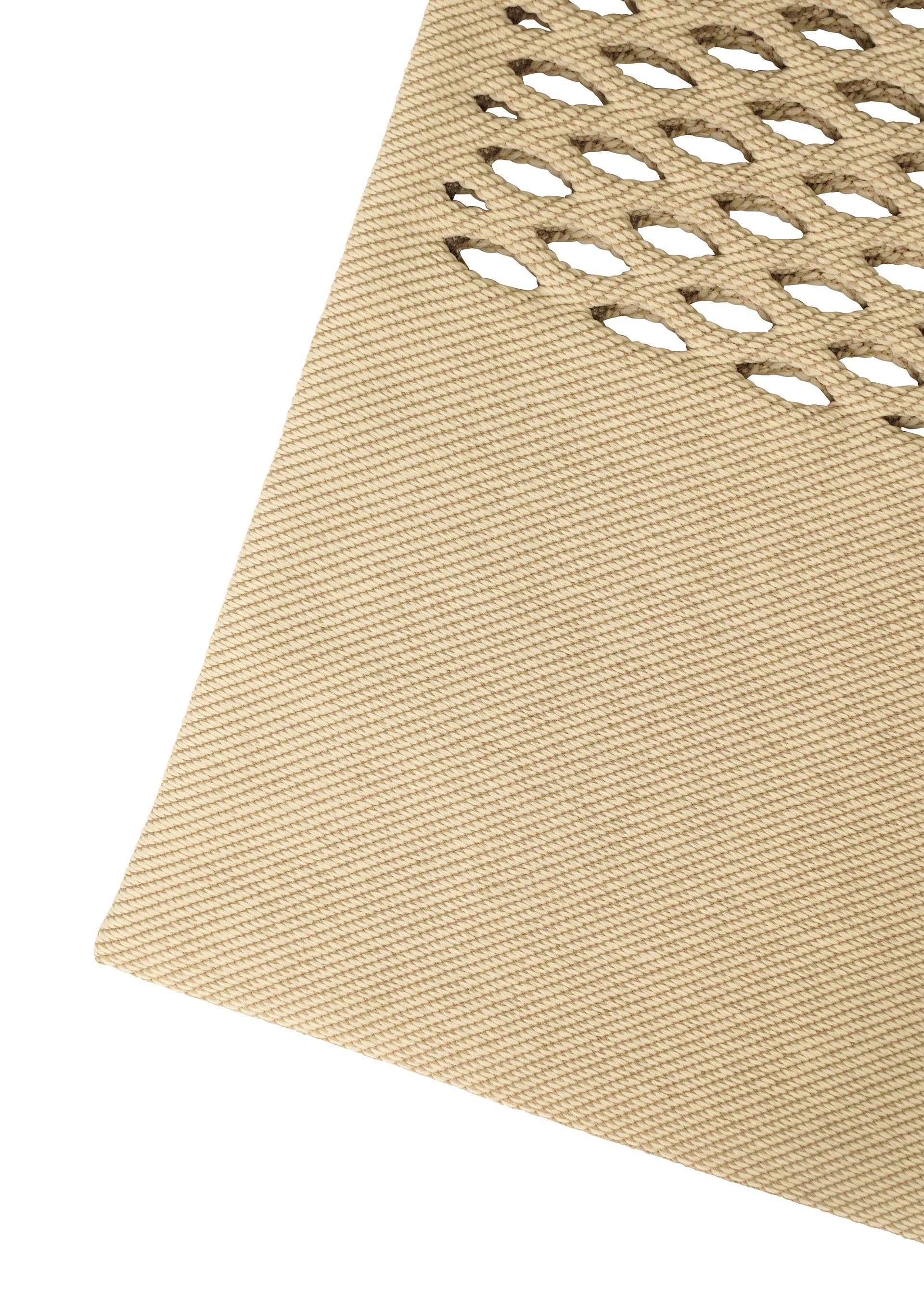 Zoomed view Close-up of the beige textured MOKKO BASKET by GOOD GOODS ISSEY MIYAKE, showing diagonal lines and a grid of oval cutouts on the upper right, reminiscent of a washable knit drawstring bag’s pattern.