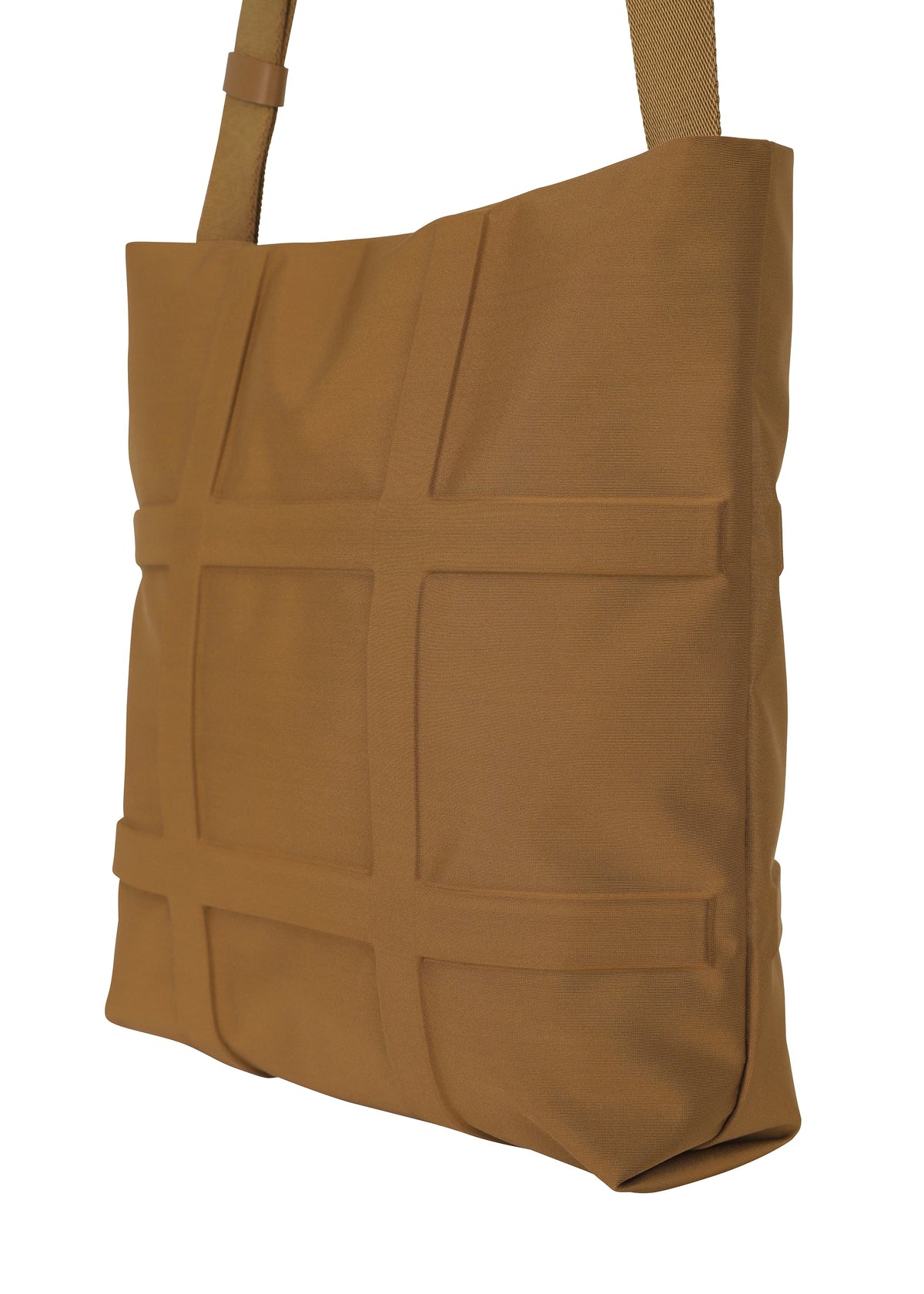 The GRID shoulder bag by GOOD GOODS ISSEY MIYAKE features a tan, rectangular design with a textured grid front and matching strap, crafted from sturdy fabric. view 8 of 10