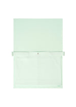 The ROLL by GOOD GOODS ISSEY MIYAKE is a minimalist light green and white wall-mounted organizer with a large front pocket, flap cover, central snap button closure, and an elegant sheen.