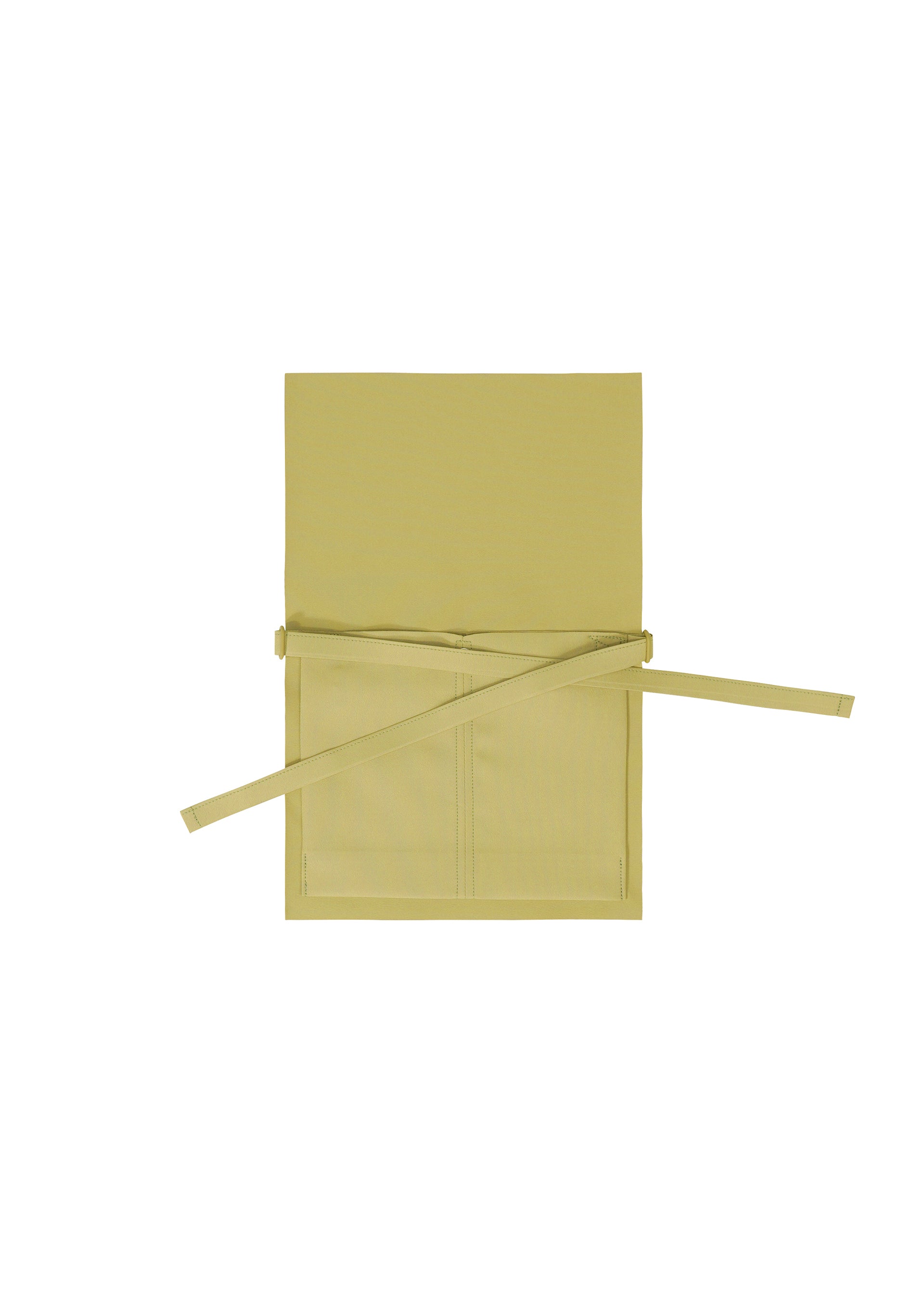 Zoomed view The GOOD GOODS ISSEY MIYAKE ROLL apron in beige or light yellow is shown laid flat on a white background, featuring a neck loop, two front pockets, and extended waist ties.