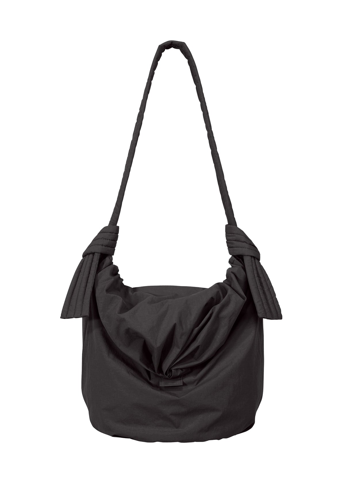 Introducing the FUWA FUWA shoulder bag by GOOD GOODS ISSEY MIYAKE: a black fabric bag featuring a generous, ruched body with pleated sides and a single thick strap, secured with large decorative knots on each side. Inspired by traditional Japanese aesthetics and zero-waste design principles, this bag offers a soft, casual appearance. view 1 of 8