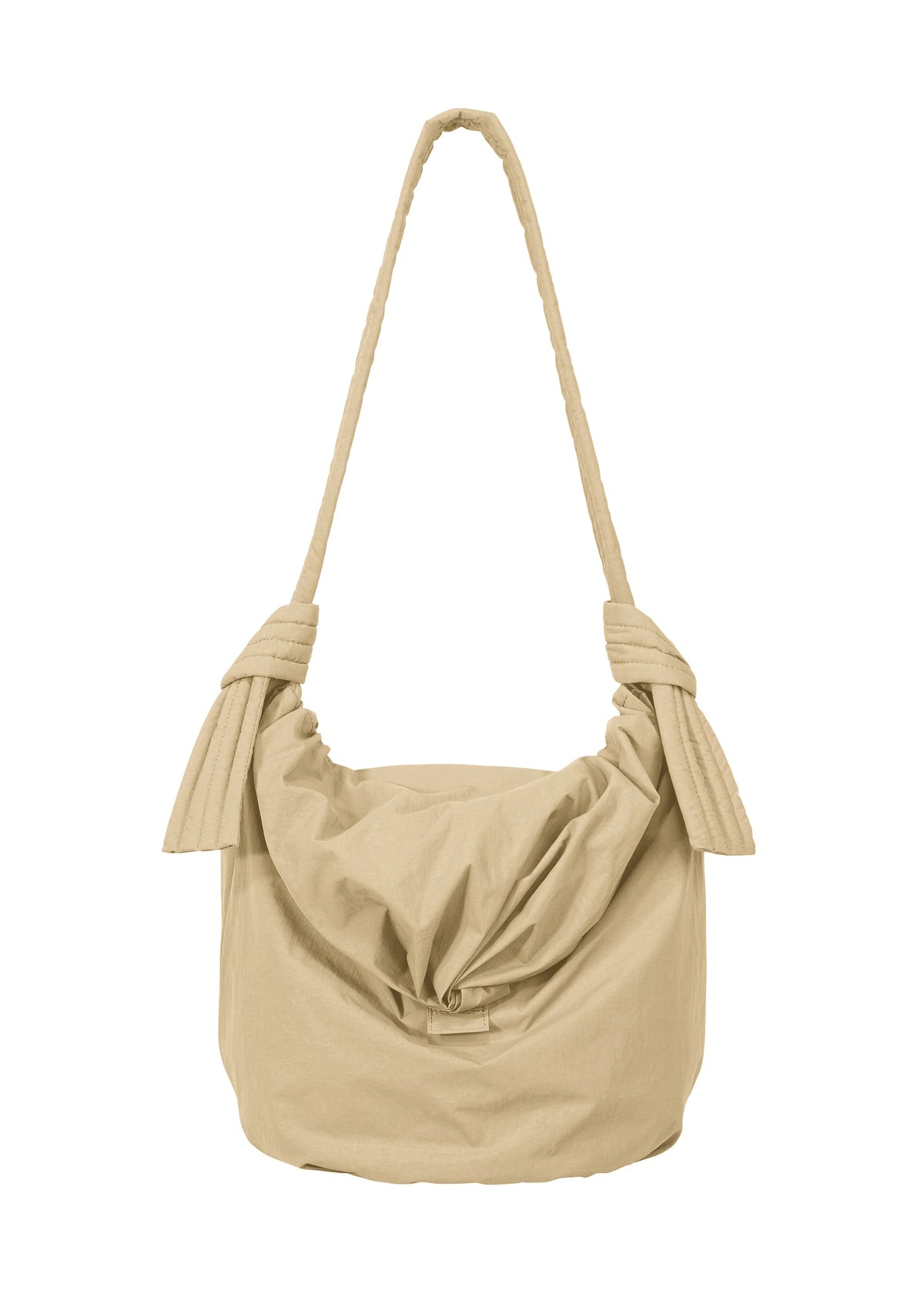 The FUWA FUWA shoulder bag by GOOD GOODS ISSEY MIYAKE is a beige fabric accessory featuring a knotted strap and a relaxed, slouchy silhouette. Inspired by traditional Japanese aesthetics and crafted with a mindful zero-waste design approach, it is shown against a white background. view 2 of 8