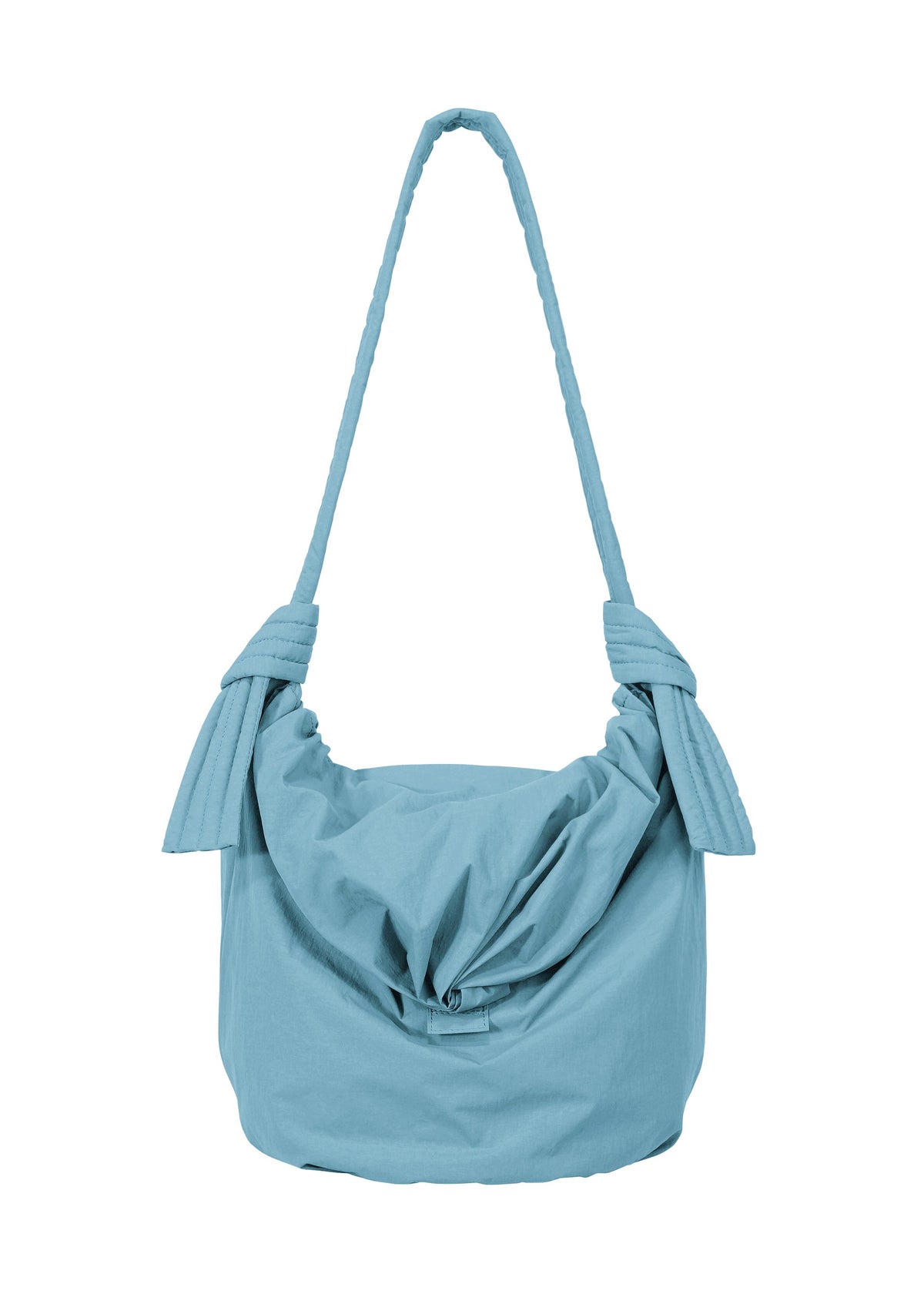 Introducing the FUWA FUWA shoulder bag by GOOD GOODS ISSEY MIYAKE: a light blue, fabric accessory featuring a knotted design on each side of the strap and a gathered, pouch-like silhouette. Inspired by traditional Japanese aesthetics, its soft, subtly textured material stands out against a clean white background. view 3 of 8