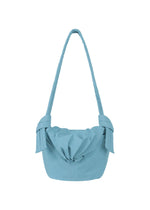Introducing the FUWA FUWA shoulder bag from GOOD GOODS ISSEY MIYAKE—a light blue fabric accessory with a gathered top closure, relaxed and casual silhouette, and distinctive knotted details on each side of the strap. Inspired by Japanese noragi craftsmanship, this bag combines a soft yet structured shape with thoughtfully implemented zero-waste design principles. - LIGTH BLUE （no.71）