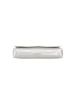 A silver rectangular metal object from GOOD GOODS ISSEY MIYAKE’s BOX collection is photographed from the side, showcasing its flat, smooth surface and slightly angled edges against a white background.