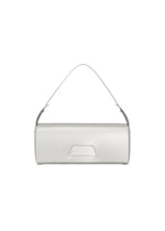 A minimalist, cylindrical silver convertible handbag by GOOD GOODS ISSEY MIYAKE, named BOX, featuring a short single top handle and centered against a plain white background.