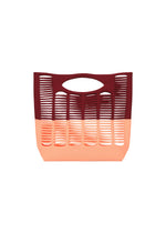 The MOKKO BI-COLOR by GOOD GOODS ISSEY MIYAKE is a washable, two-tone open-weave tote with a maroon top, peach bottom, vertical slits, and a curved handle for stylish, easy-care use. - BORDEAUX×LIGTH SALMON （no.85）