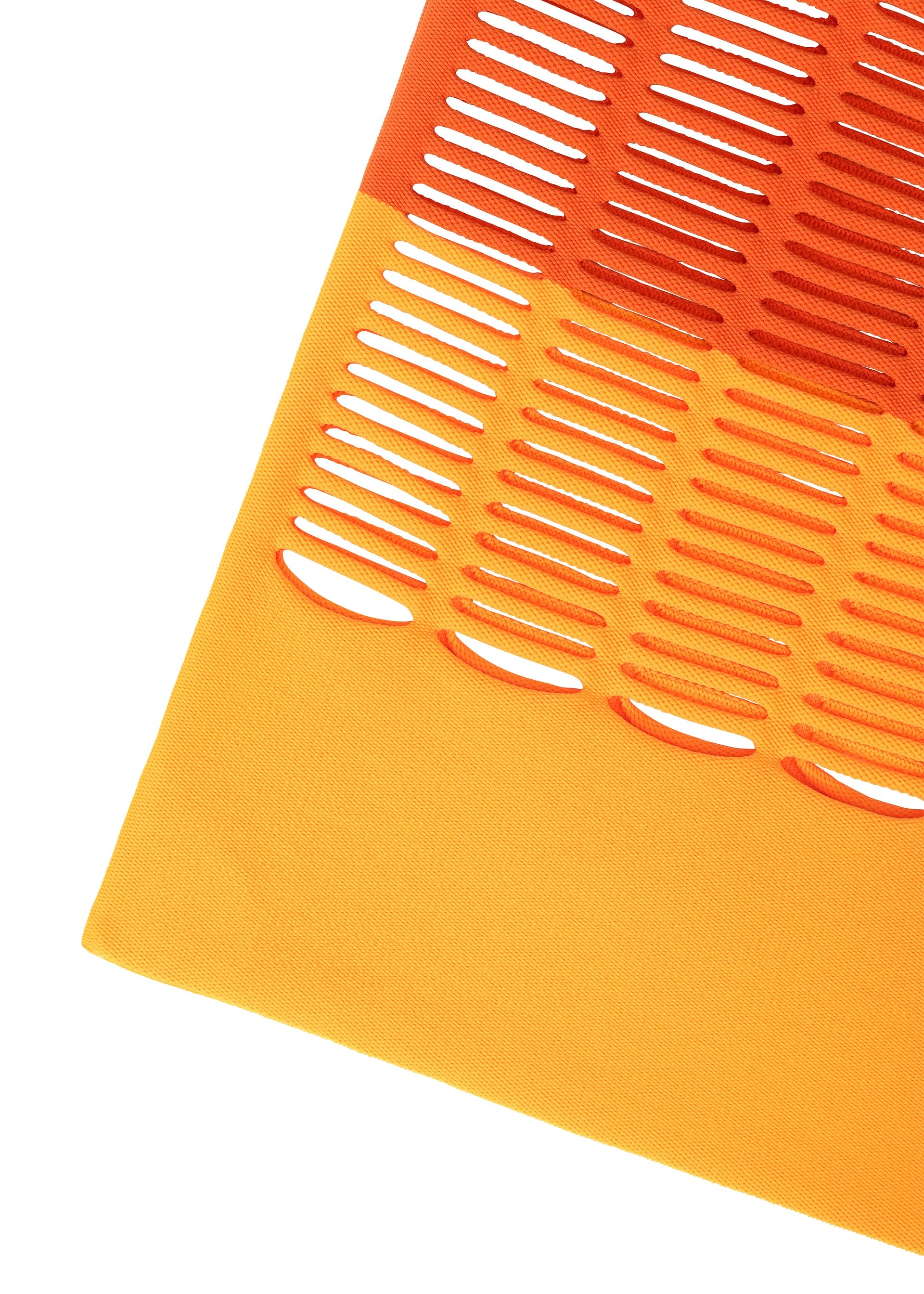 Zoomed view The MOKKO BI-COLOR by GOOD GOODS ISSEY MIYAKE is a knit bag with orange and yellow panels; oval cut-outs in the orange section create a striped, perforated look over the solid yellow. Ideal as a washable tote.