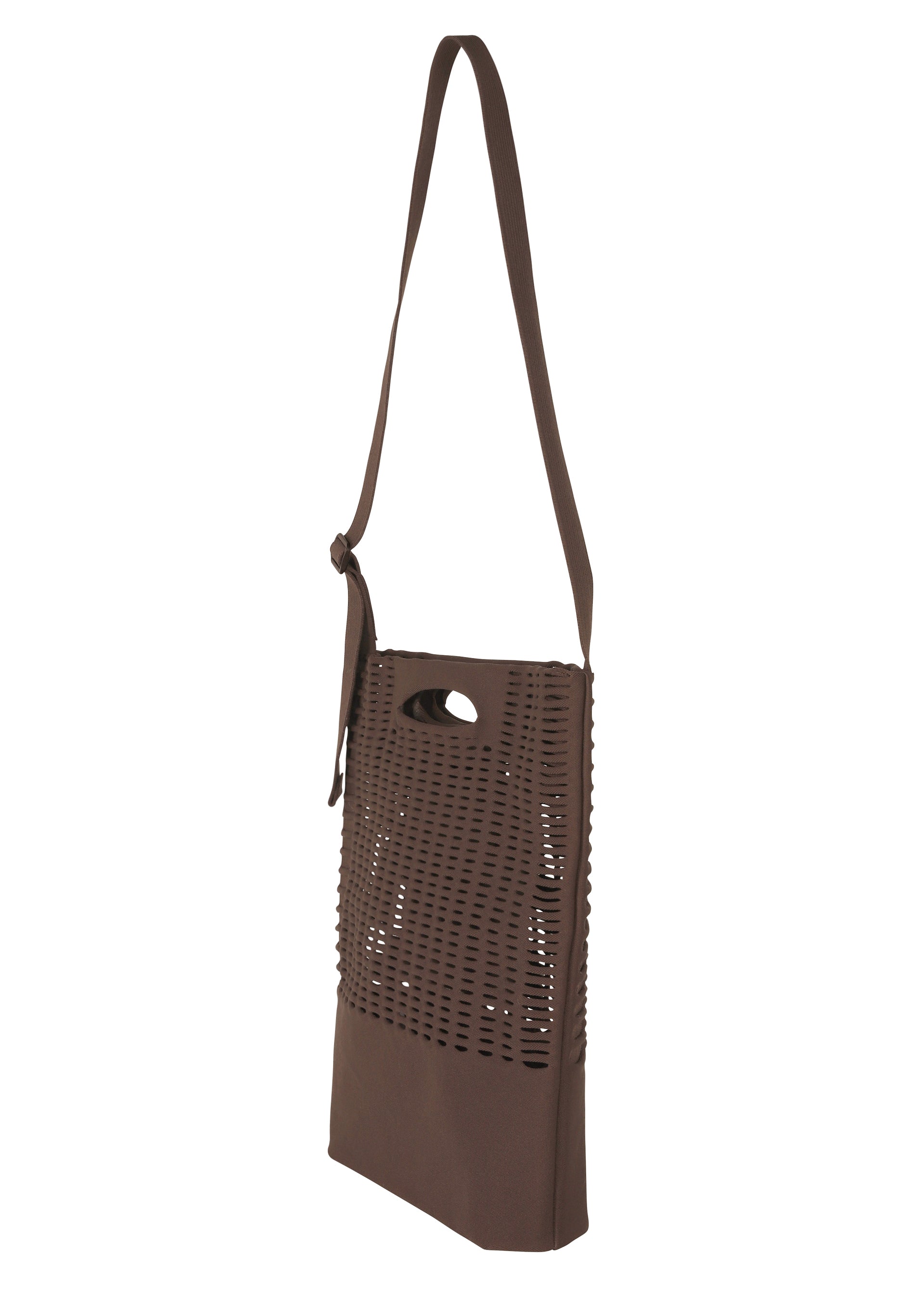 Zoomed view The MOKKO MONO GRIP by GOOD GOODS ISSEY MIYAKE is a brown shoulder bag accented with a laser-cut perforated pattern on the front. It features an adjustable shoulder strap and a built-in handle hole near the top. With its modern, minimalist design, this bag is perfect both as a sleek business accessory and as a versatile tote for everyday use.