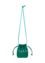 The MOKKO POCKET BI-COLOR by GOOD GOODS ISSEY MIYAKE is a small teal shoulder pouch with a long strap and decorative cutout pattern, shown here as a mini drawstring bag against a white background. - TEAL GREEN （no.76）