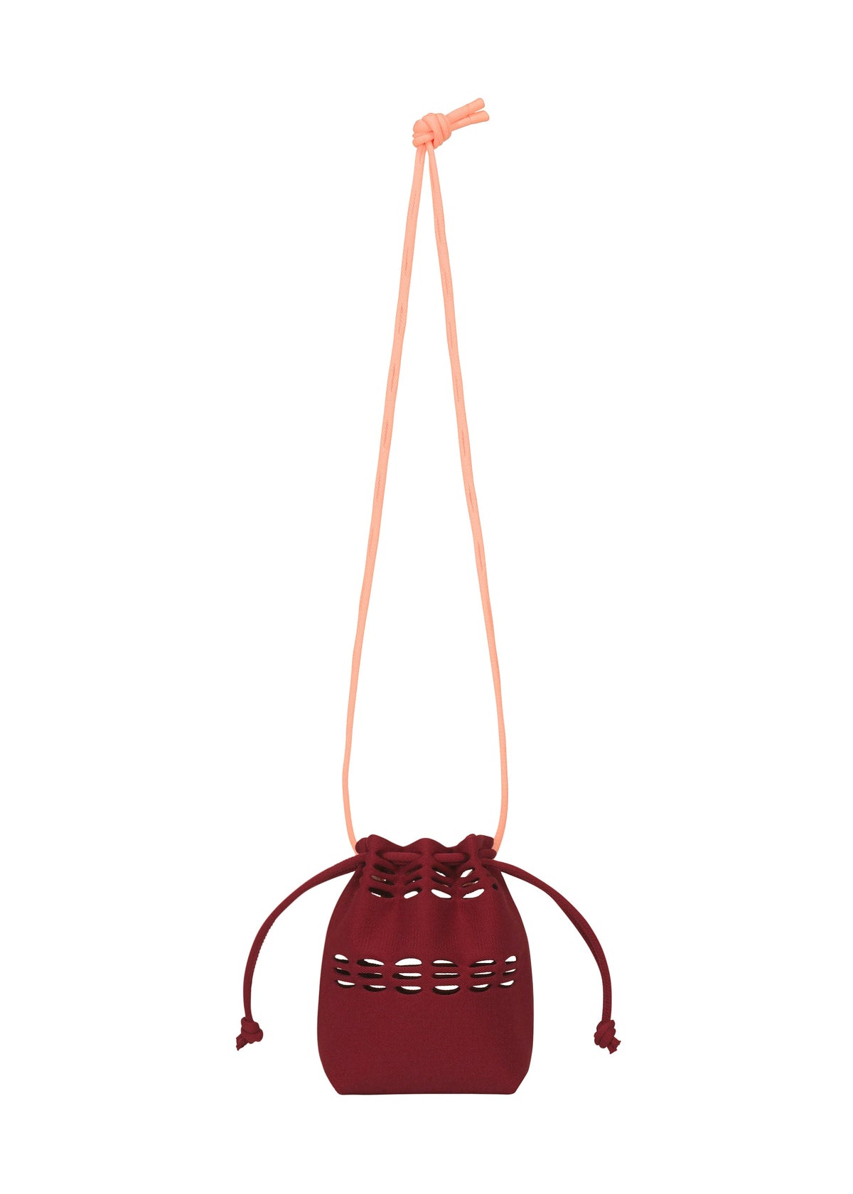 The MOKKO POCKET BI-COLOR by GOOD GOODS ISSEY MIYAKE is a small maroon drawstring bag with a long light pink strap and decorative cutout details, shown on a white background. view 4 of 9