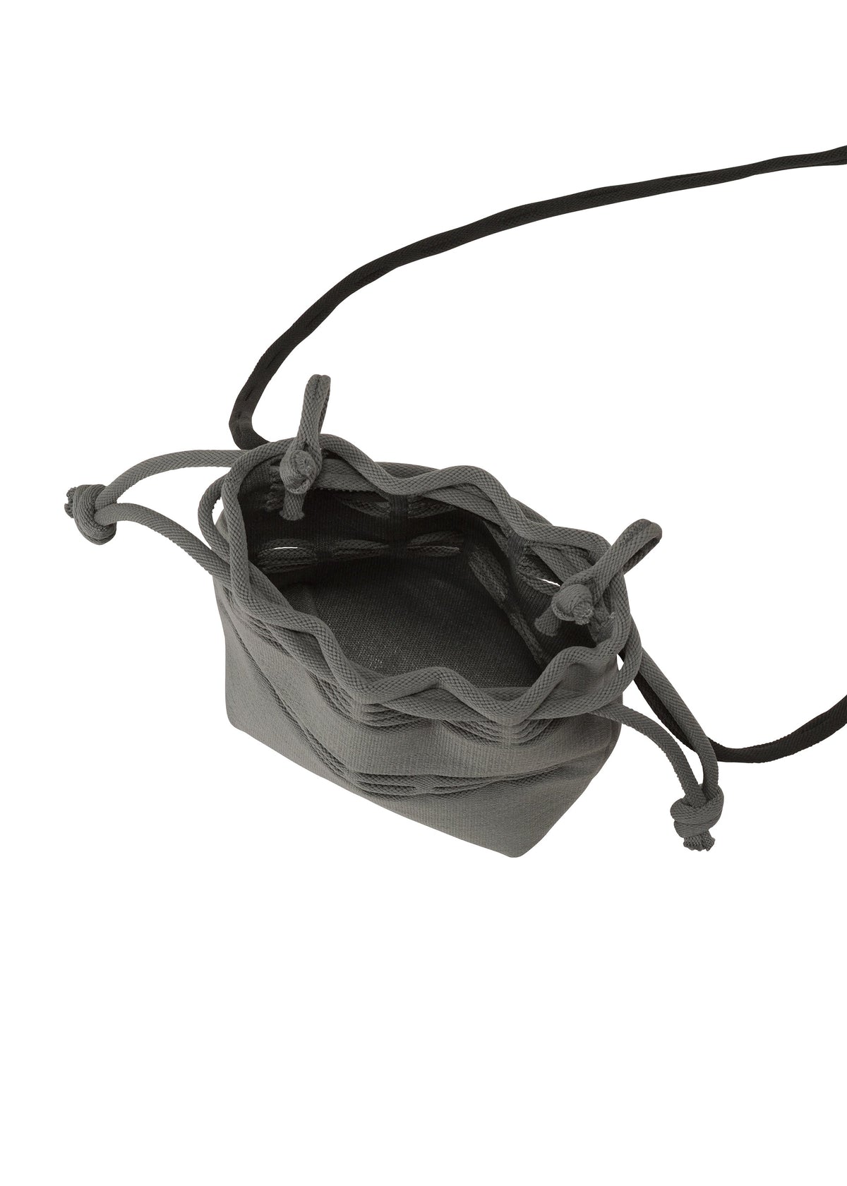 The MOKKO POCKET BI-COLOR by GOOD GOODS ISSEY MIYAKE is a small gray fabric mini bag with a drawstring closure and a long black strap, shown open and empty from above. view 6 of 9