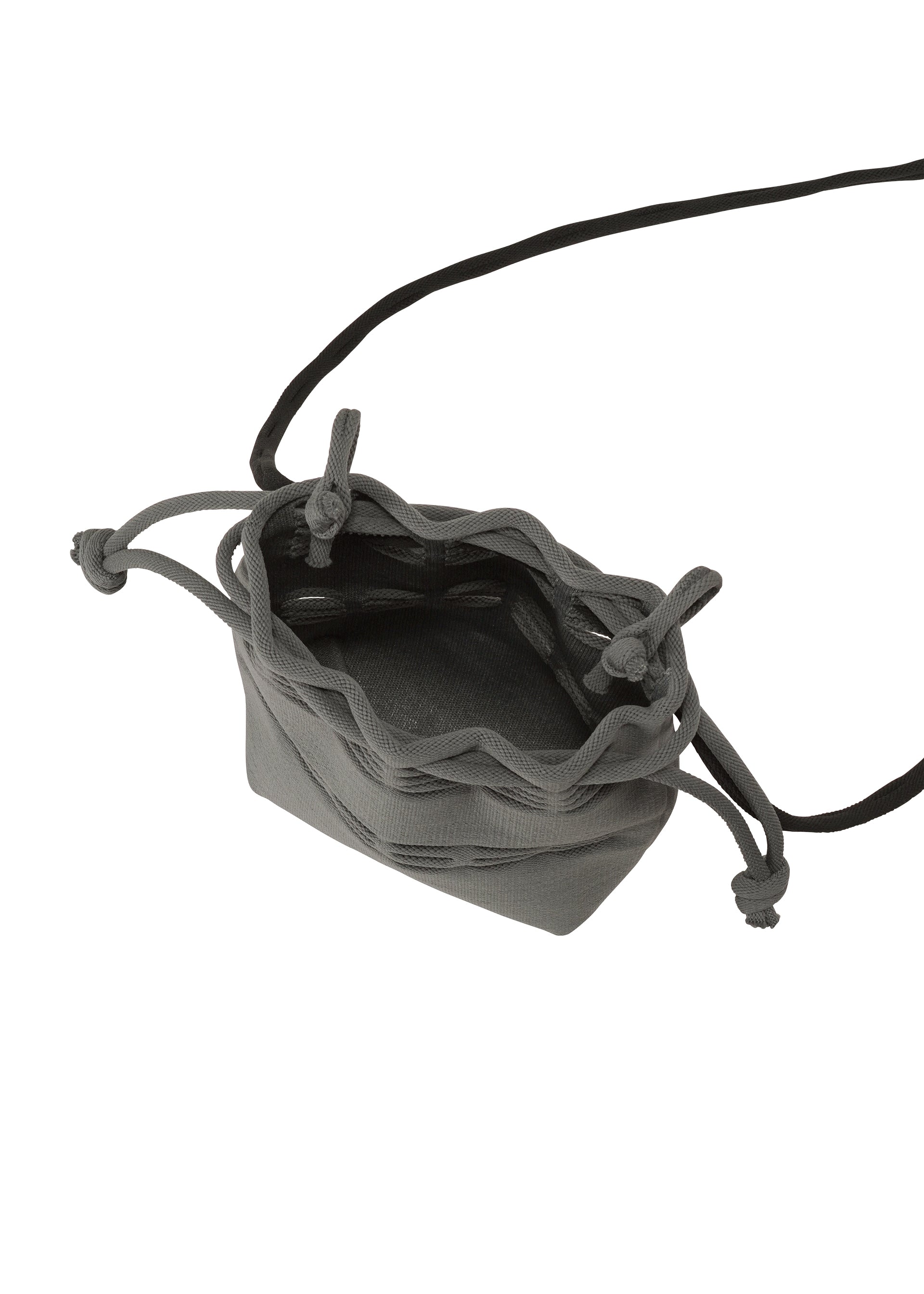 Zoomed view The MOKKO POCKET BI-COLOR by GOOD GOODS ISSEY MIYAKE is a small gray fabric mini bag with a drawstring closure and a long black strap, shown open and empty from above.