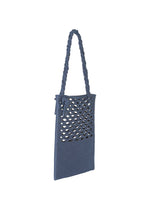 The MOKKO WASHI by GOOD GOODS ISSEY MIYAKE is a blue rectangular fabric shoulder bag with a twisted handle and oval cutouts on the front panel, shown against a white background.